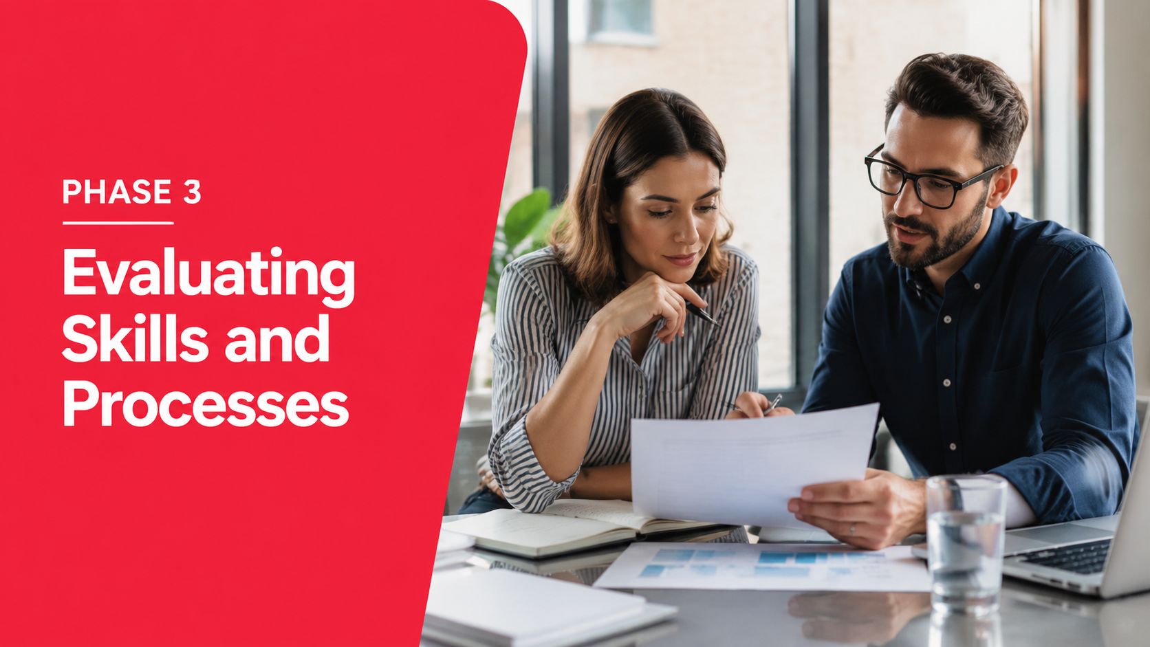 A professional man and woman collaborating and reviewing business documents together in a modern office environment.
