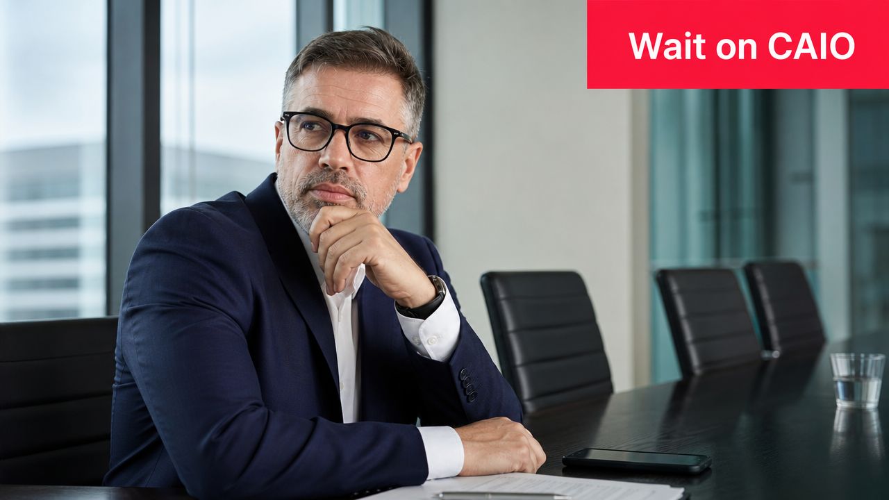 A professional man sitting at a boardroom table, reflecting on the potential need for a chief AI officer.